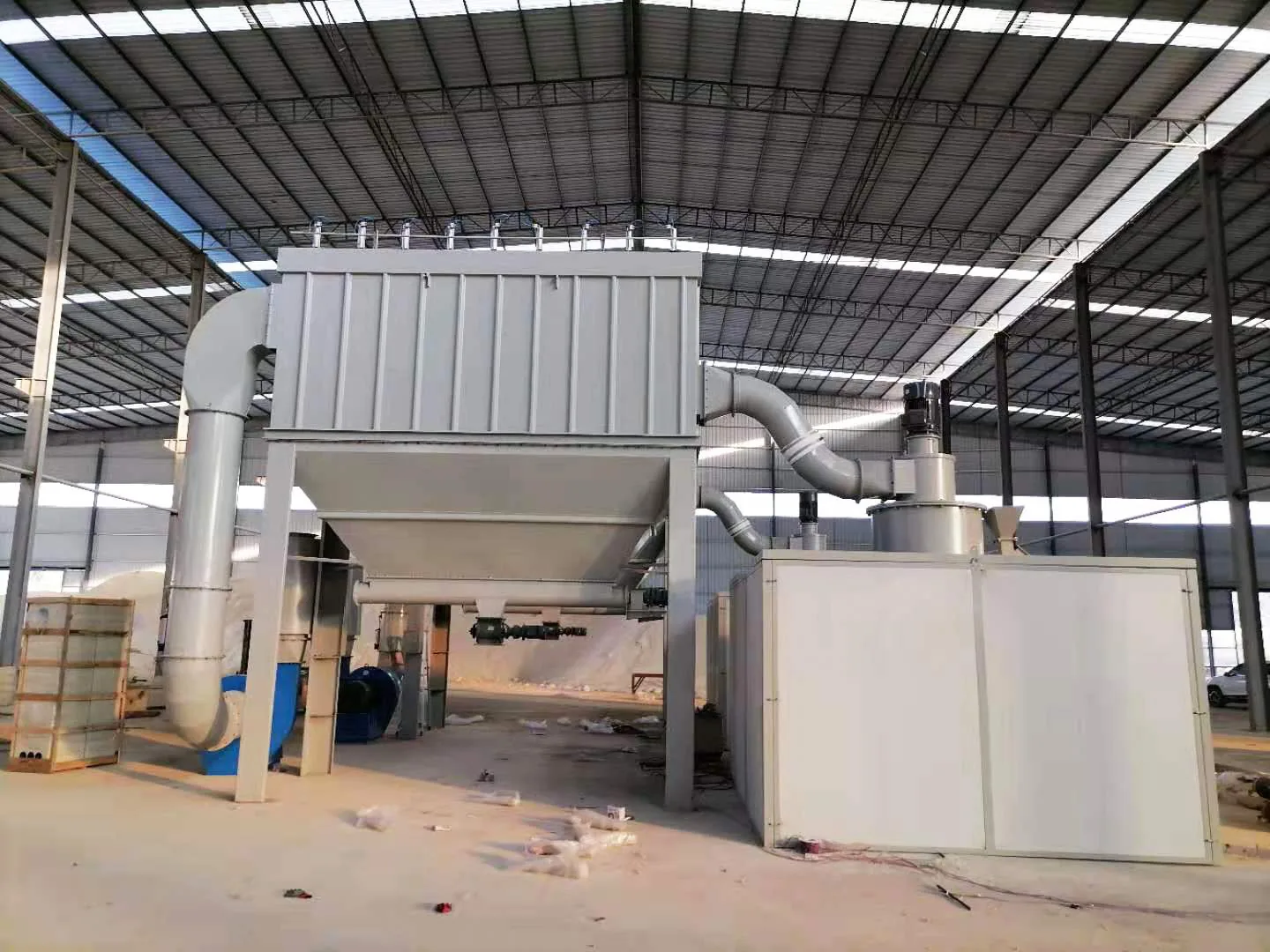 Industrial ultrafine grinding equipment installed inside a production workshop